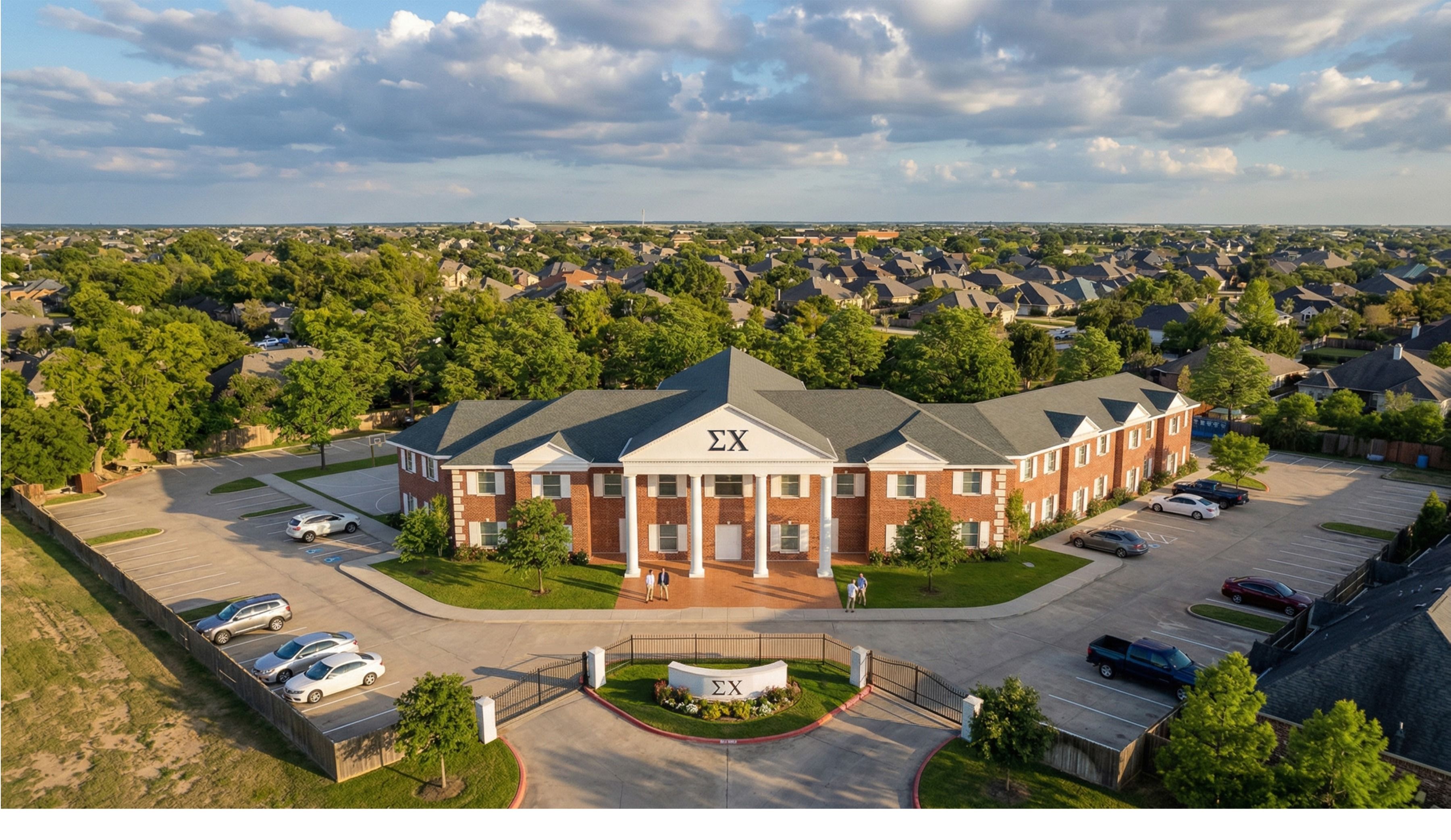 Sigma Chi fraternity house rendering, aerial view of the main entry and gated drive